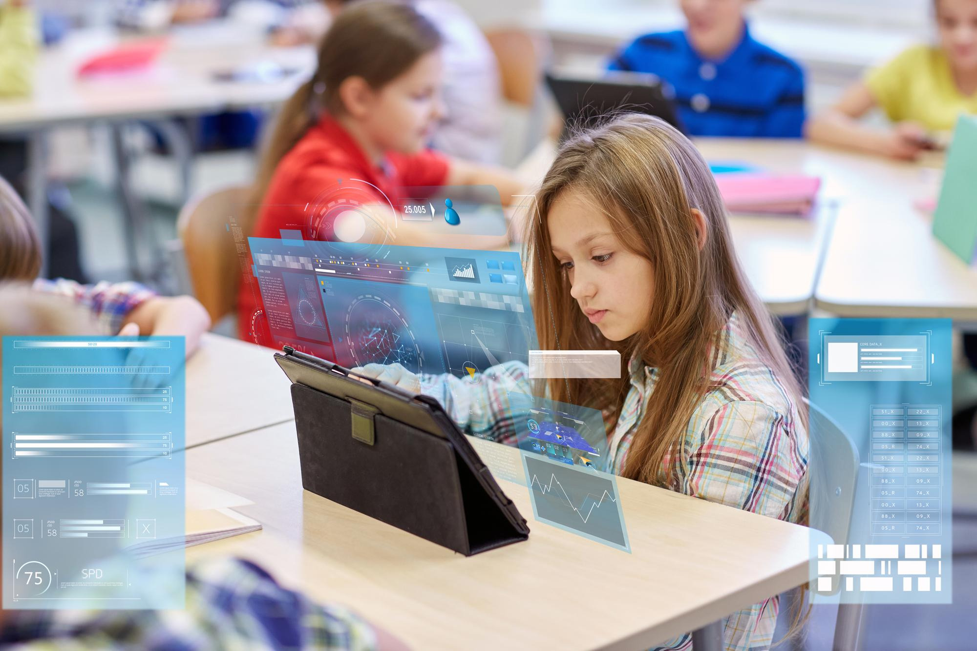 Pupils using tablets in a classroom with analytics-style overlays, illustrating real-time online activity monitoring and safeguarding alerts for Yorkshire schools and Multi-Academy Trusts.